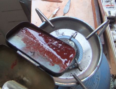 smelten van pigmenthoudende was